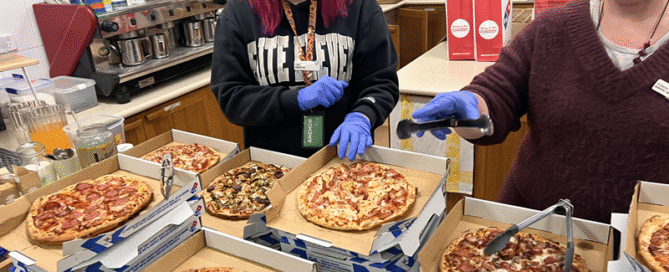 Anchor staff serve food at StableOne Winter Shelter during Homelessness Week