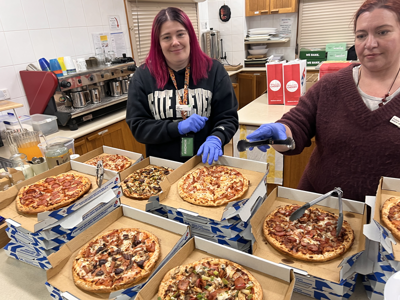 Anchor staff serve food at StableOne Winter Shelter during Homelessness Week
