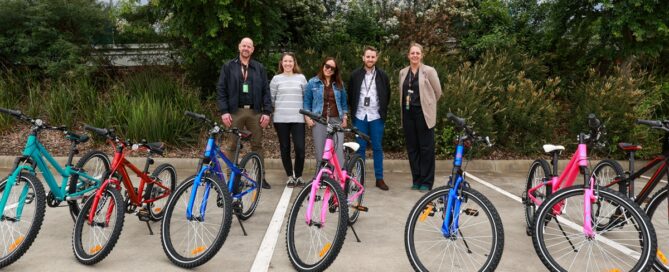 QMetrix delivering donated bikes to Anchor Community Care
