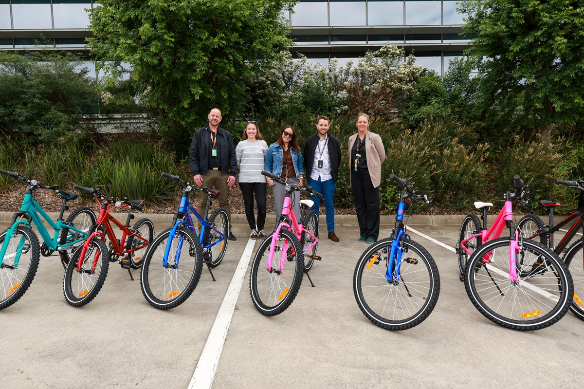 QMetrix delivering donated bikes to Anchor Community Care